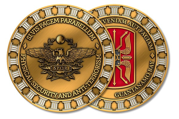 Proof of a double-sided challenge coin design, featuring a golden eagle and the SPQR acronym on one side, embodying 'Physical Security and Anti-Terrorism.' The reverse showcases a bold red and gold emblem with 'VENIAM AUT FACIAM' and 'GUANTANAMO BAY' text, representing commitment and strength.