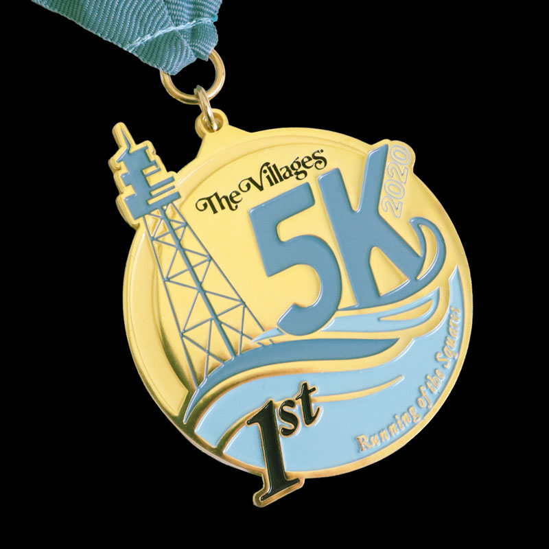 Gold custom 5K medal for The Villages Running of the Squares 2020 with a light blue ribbon and tower silhouette