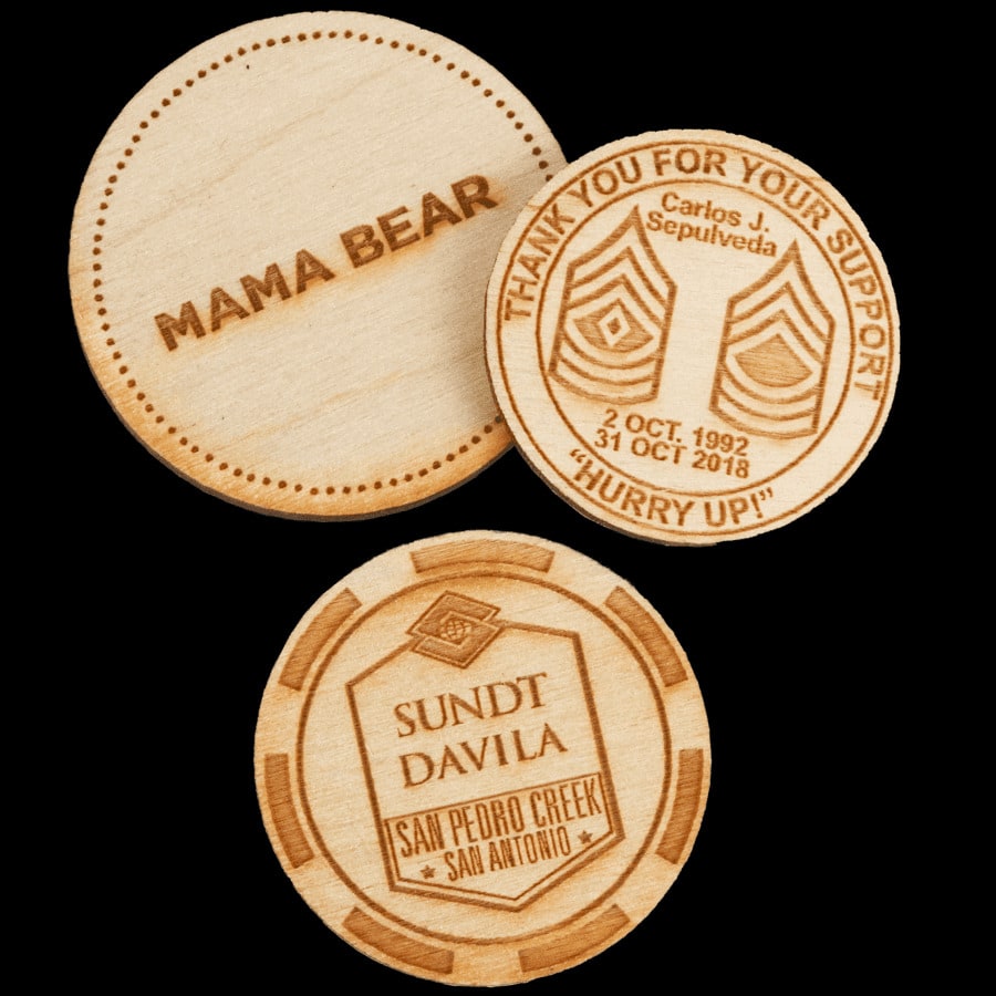 a few examples of wooden poker chips with custom designs